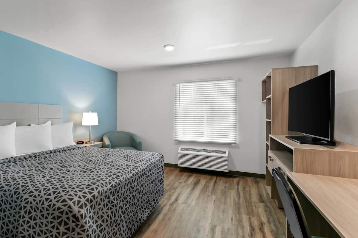 Desk, laptop workspace, blackout curtains, free WiFi