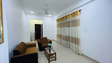 Deluxe Apartment, Balcony, Sea View | Living area | 32-inch flat-screen TV with digital channels