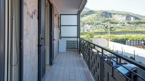 A balcony with a view of a mountainous landscape, a tiled floor, and a railing. - Ideal for exploring the Amalfi Coast, Capri, Sorrento, Pompeii, Paestum and more (Salerno)