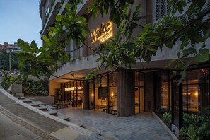 A modern building with a sign reading "Wake Biohotel". - Wake BioHotel, a Member of Design Hotels (Medellín)