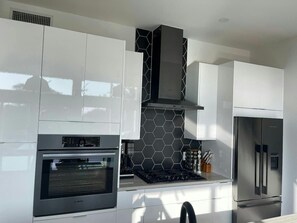 Fridge, microwave, oven, stovetop - PreGame penthouse rooftop patios and firepits (Austin)