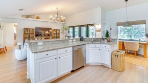 A modern kitchen with white cabinets, granite countertops, and stainless steel appliances. - Near Parks & Lakes: Sorrento Home w/ Pool & Yard! (Sorrento)