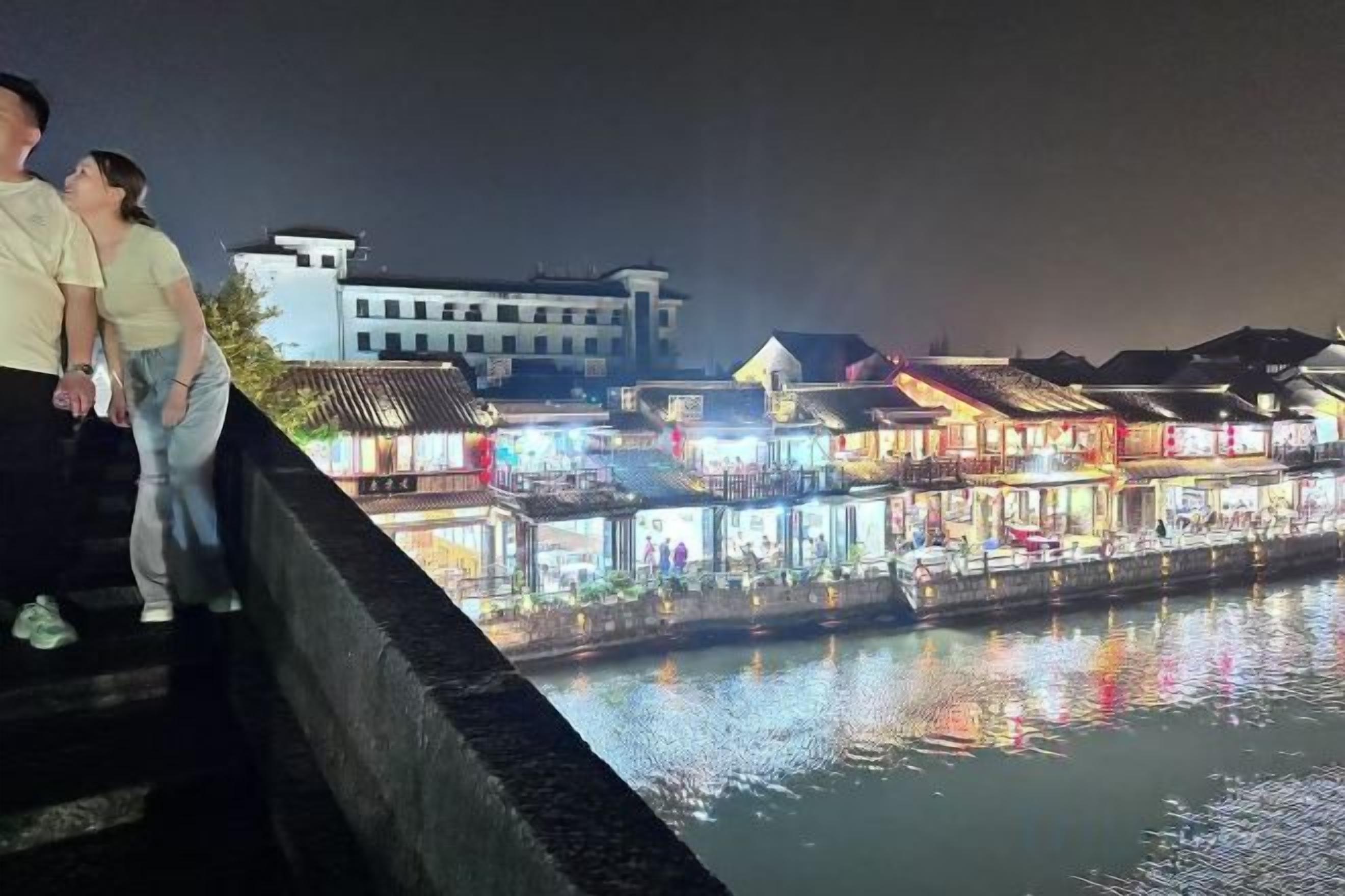 A waterfront view with buildings along the riverbank.
