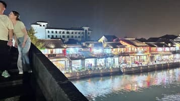 A waterfront view with buildings along the riverbank.