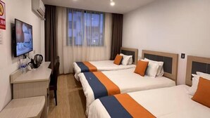 A hotel room with three beds, a desk, a TV, and a window with curtains. - Shanghai Jinxiang Hotel (Zhujiajiao Ancient Town) (Shanghai)