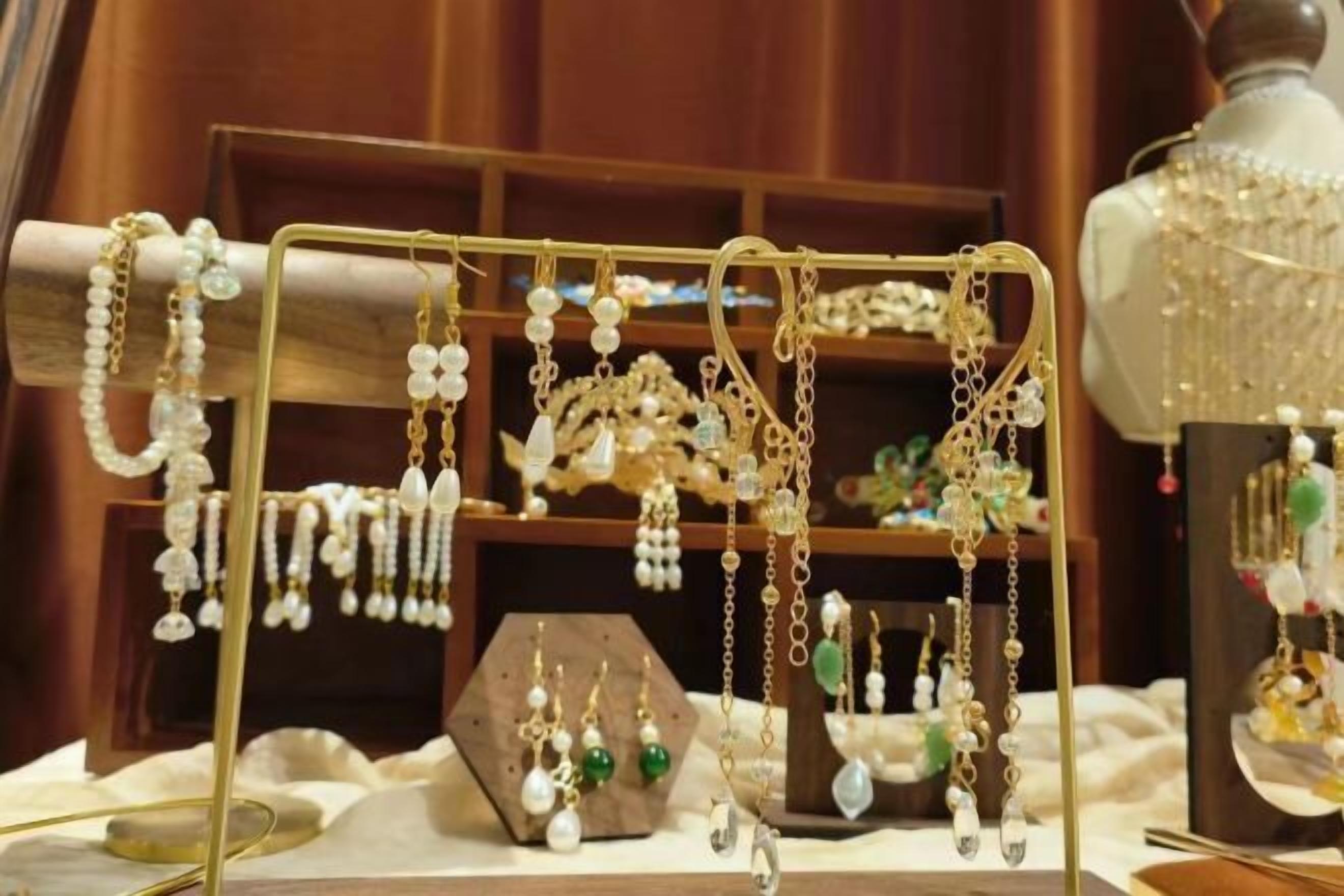 A jewelry display with various earrings on a stand.