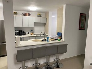 Fridge, microwave, stovetop, coffee/tea maker