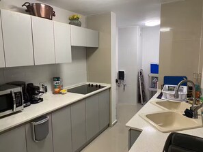 Fridge, microwave, stovetop, coffee/tea maker