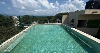 Affordable apartment #12 with a rooftop terrace and pool, near the sea. Tower 70