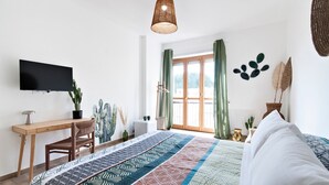 A bedroom with a bed, a desk, a chair, a television, and a window with curtains. - 7Rooms - The Countryside (Lecce)