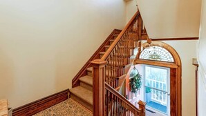 A wooden staircase with a glass door at the top. - Large Space Great for Special Occasions: 2 Floors (Montclair)
