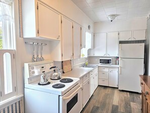 Fridge, microwave, oven, stovetop - Whispering Meadows Manor is a 4 bedroom 1.5 bath country home (Bonshaw)