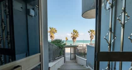 GuestHost - Spacious and cosy 40 sqm flat, sleeping up to 4 people, on the 1st floor of a house (WITHOUT LIFT with steps to access it).The property is located on the Lungomare Cristoforo Colombo promenade, where you can enjoy a wonderful walk to the Port
