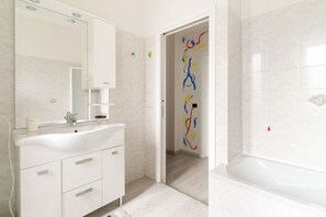 Hair dryer, bidet, towels, toilet paper