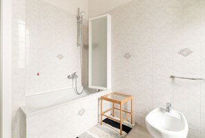 Hair dryer, bidet, towels, toilet paper