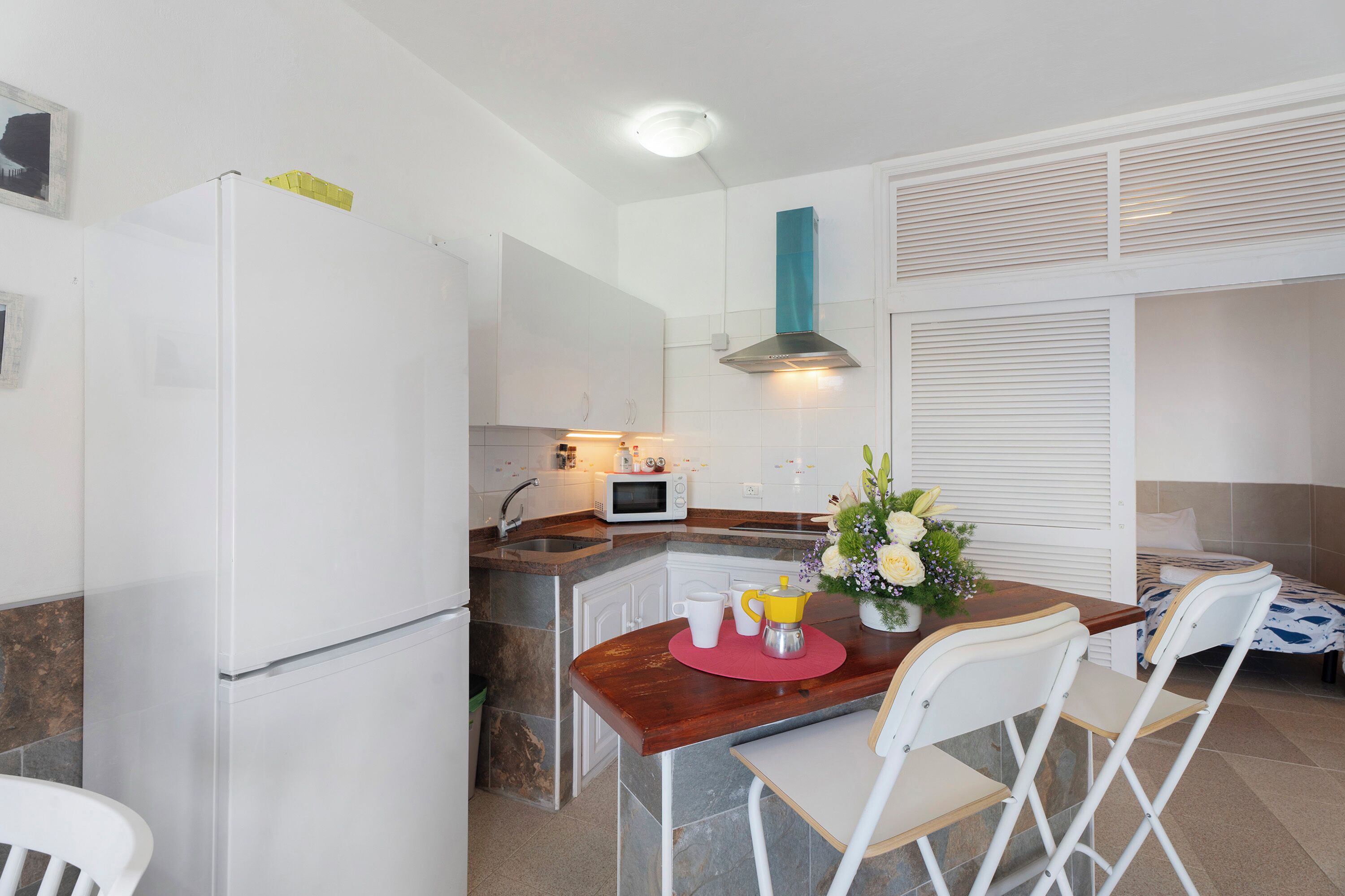 Fridge, microwave, stovetop, coffee/tea maker