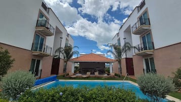 Outdoor pool, open 9:00 AM to 8:00 PM, sun loungers