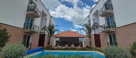 Outdoor pool, open 9:00 AM to 8:00 PM, sun loungers