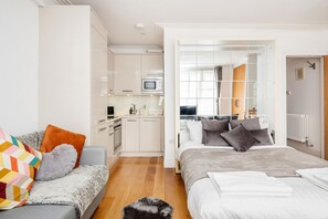 1 bedroom, desk, iron/ironing board, travel crib