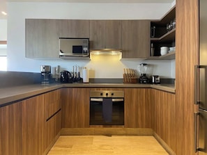 Fridge, microwave, stovetop, coffee/tea maker