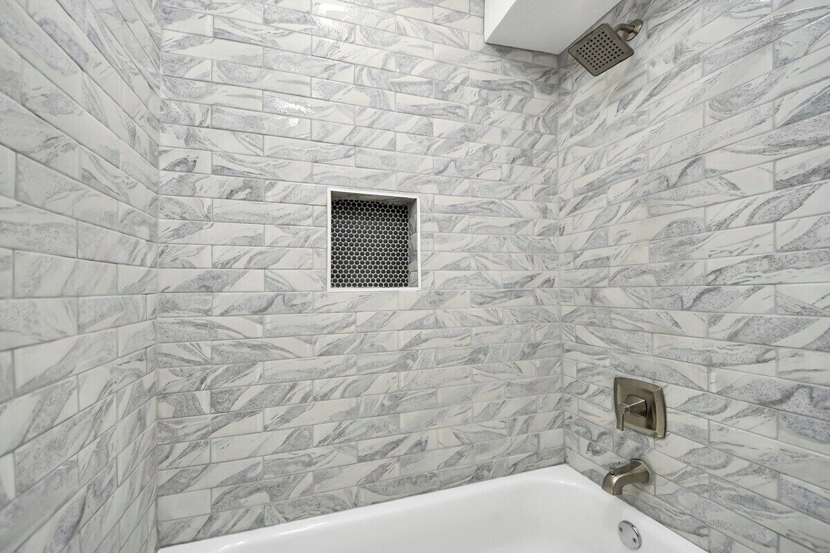 Shower, hair dryer, towels, shampoo