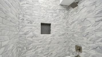 Shower, hair dryer, towels, shampoo
