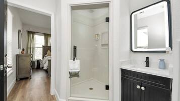 Shower, hair dryer, towels, shampoo