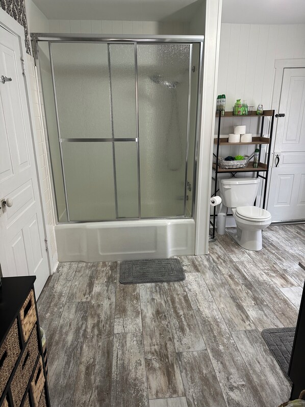 Shower, towels, soap, toilet paper