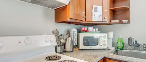 Fridge, microwave, stovetop, coffee/tea maker