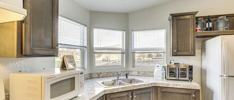 Fridge, microwave, stovetop, coffee/tea maker