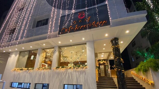 A building with a sign that reads "Hotel Celebration."