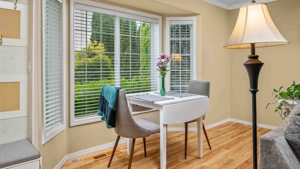 A room with a white desk, a chair, a lamp, and a window with blinds. - Fantastic Single Level Ranch Layout, Fenced Backyard w/ Large Deck, New Decor and Furnishing (Hillsboro)