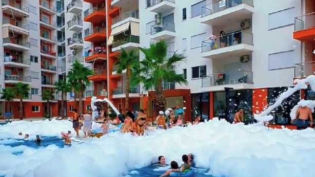 A swimming pool surrounded by ice, with people enjoying the cold water. - Stunning Lezhë Apartment With Sea View and Modern Amenities (Shengjin)