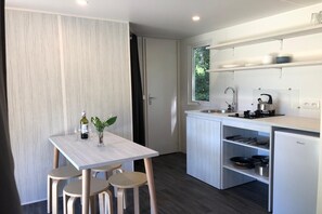 Fridge, microwave, stovetop, coffee/tea maker