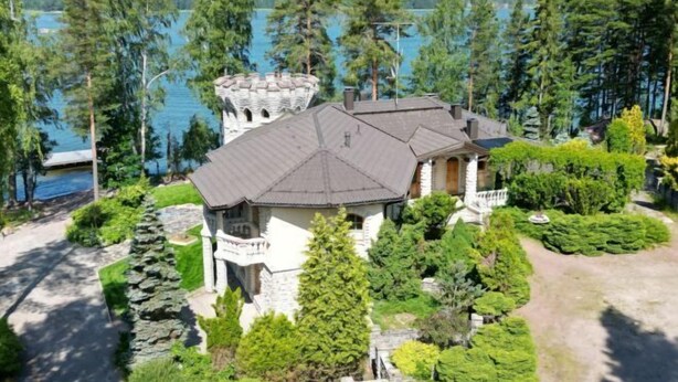 A large, stone house with a turret, surrounded by lush greenery and a lake view. - Pinecrest Villa - Castle Style Living on Seaside (Porvoo)