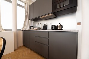 Microwave, stovetop, dishwasher, coffee/tea maker