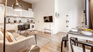A modern apartment with a kitchen, dining area, and living room. - A1.RépubliqueMarais1BedRoomParis03AC (Paris)