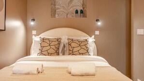 A neatly made bed with two pillows, a headboard, and two bedside lamps. - A43.République#1BedRoom#Marais#Paris03#AC (Paris)