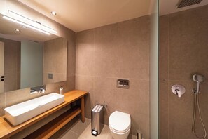 Shower, hair dryer, towels, toilet paper