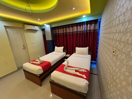 Economy Double or Twin Room, City View | In-room safe, desk, blackout drapes, free WiFi