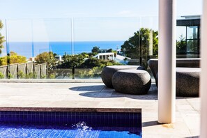 A rooftop pool area with a clear view of the sea and a modern architectural design. - Panoramic Bay Views Mt Martha (Mount Martha)