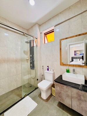 Shower, towels, soap, toilet paper