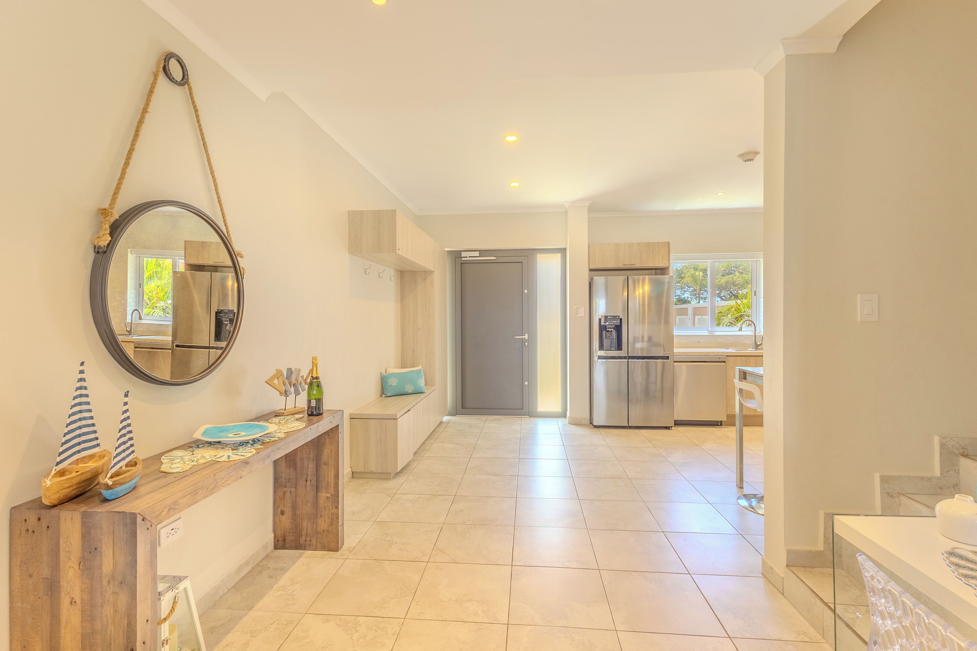 A spacious kitchen with modern appliances and a wooden counter.