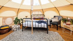 A tent with a bed, a desk, and a chair. - Glamping - The Natterjack, Bath (Charlcombe)