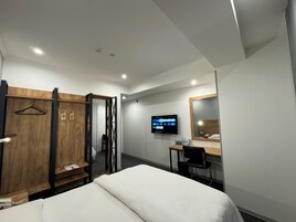 Habitación individual Deluxe | Escritorio y espacio para trabajar con un portátil