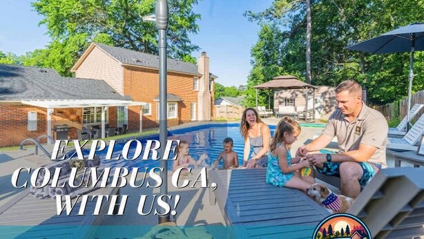 A swimming pool area with lounge chairs, umbrellas, and a house in the background. - Serene Pool retreat w/ Games Near Fort Moore (Columbus)