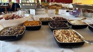 A buffet table with various food items including eggs, cereal, and nuts. - Werrapark Hotel Heubacher Höhe (Masserberg)