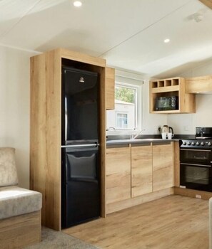 Fridge, microwave, cookware/dishes/utensils