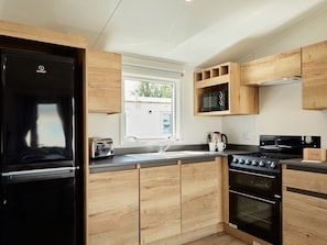 Fridge, microwave, cookware/dishes/utensils