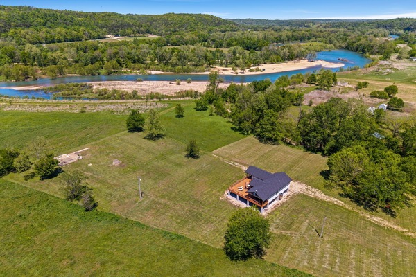 Elk View is a gorgeous, secluded riverside home nestled in 17 private acres with 600 feet of shoreline and direct access to The Elk River.